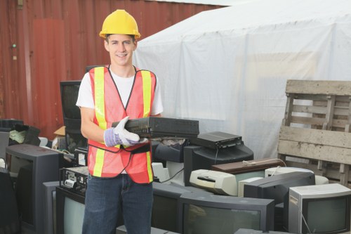 Professionals handling hazardous waste collection in Feltham