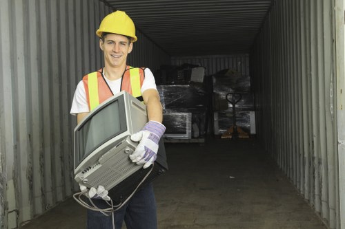 Skips being loaded for recycling at a local site
